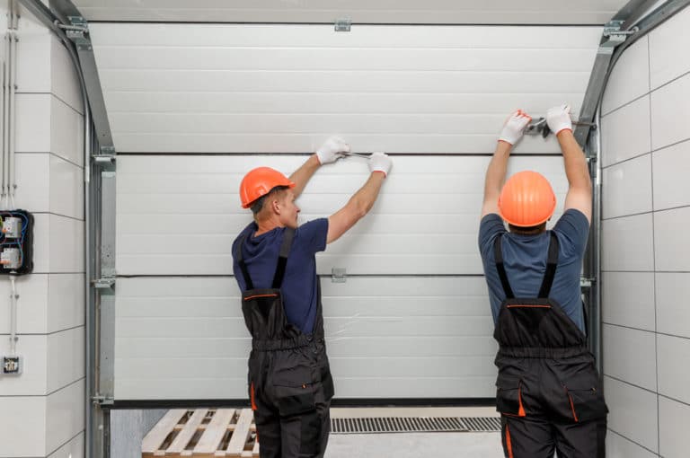 Réparation de porte de garage par onitech.